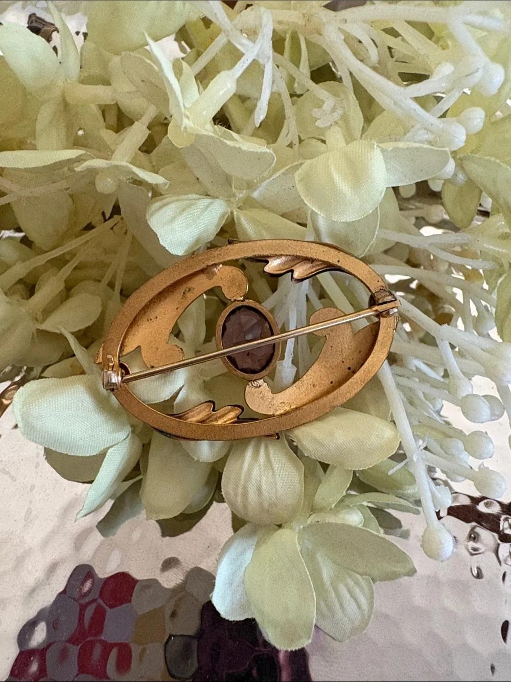 Vintage-Inspired Gold Brooch with Purple Stone